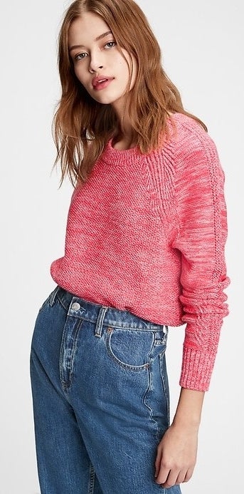 model wearing a pink pullover