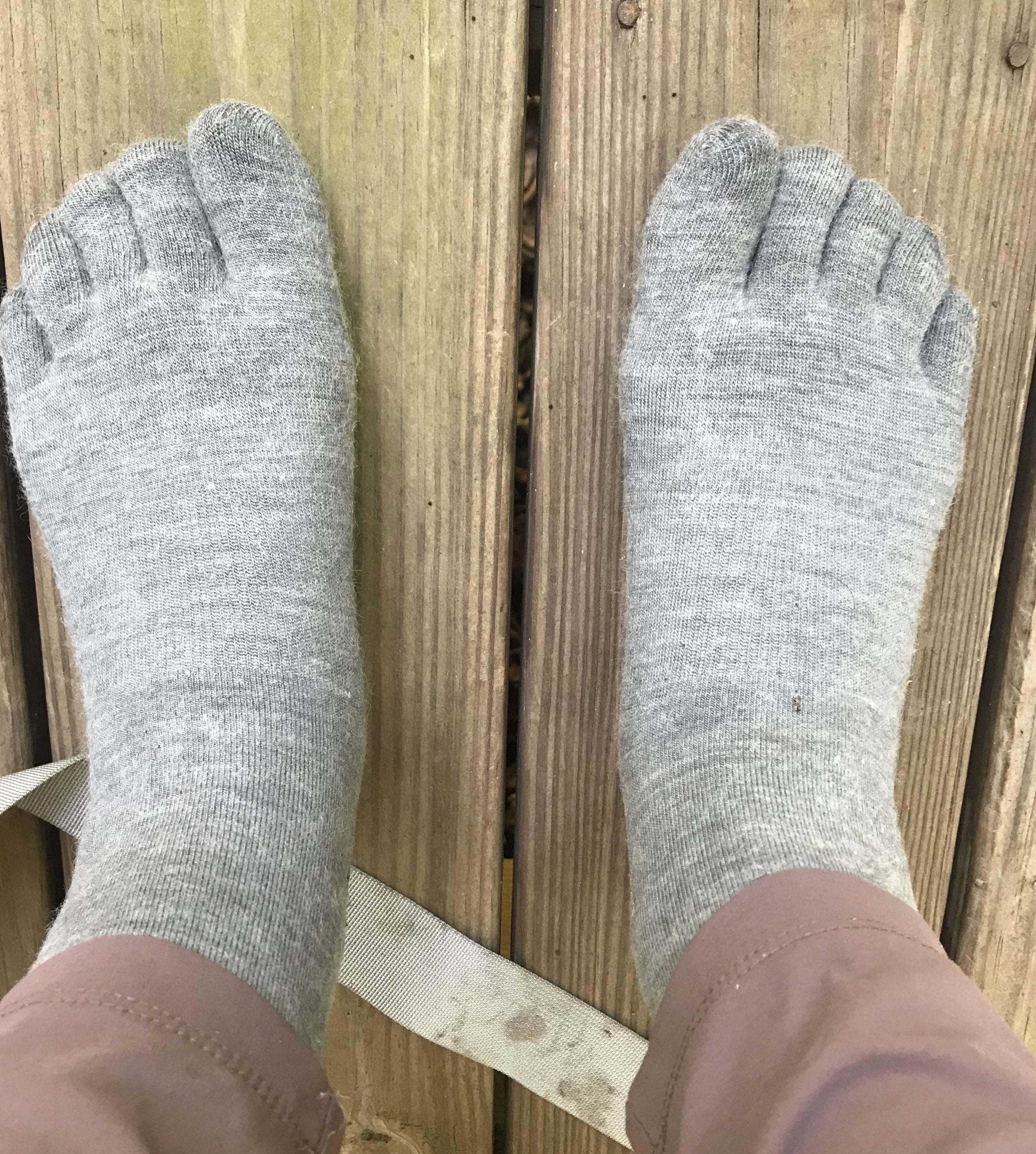 writer wearing light grey toe socks