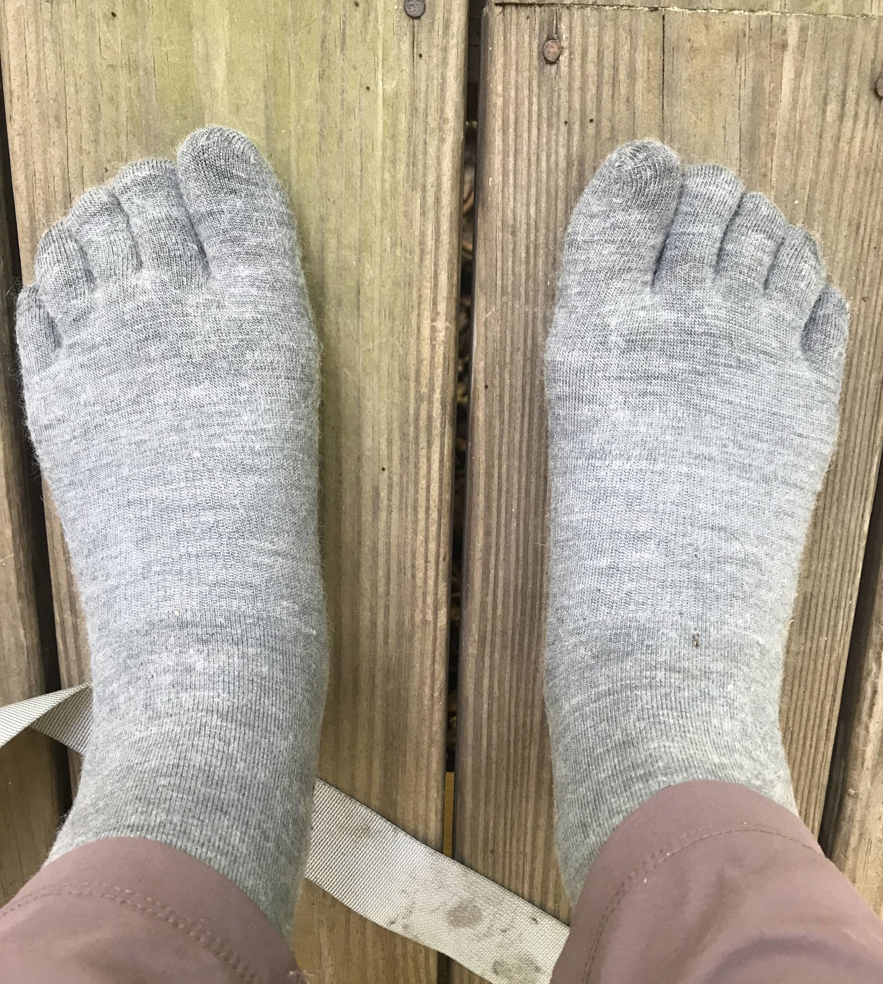 writer wearing light grey toe socks