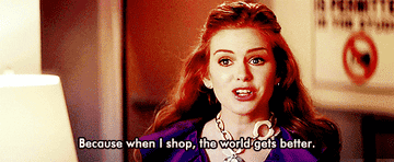 GIF of Isla Fisher in Confessions of a Shopaholic saying when I shop, the world gets better