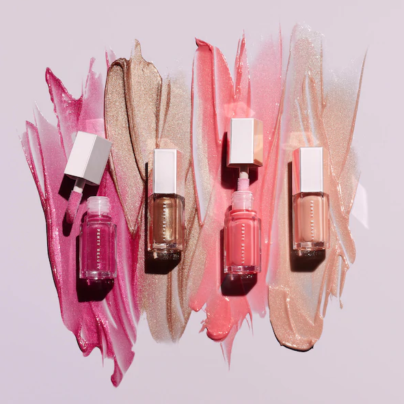 Four tubes of lip gloss in different shades