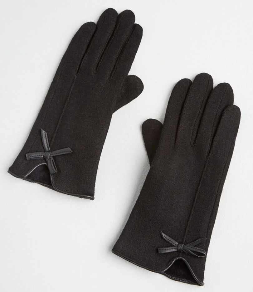 black gloves with small leather bows on the cuff