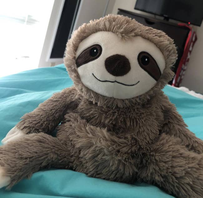 reviewer photo of the sloth plush 