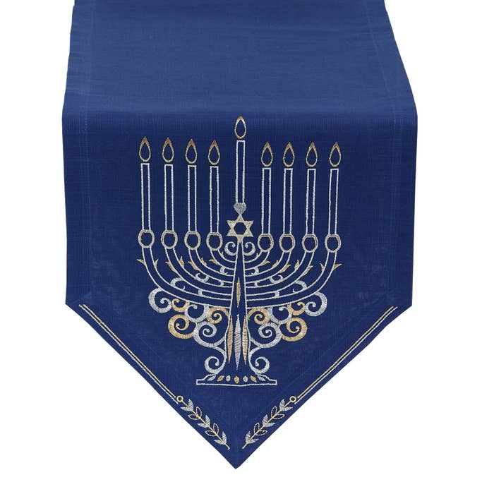 The dark blue table runner decorated with a menorah