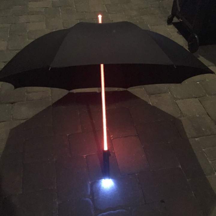 reviewer's umbrella with the handle lit up in a red light