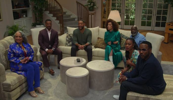 Daphne Maxwell Reid, Alfonso Ribeiro, Will Smith, Karyn Parsons, Joseph Marcell, Tatyana Ali, and DJ Jazzy Jeff sitting in a replicated living room from &quot;The Fresh Prince&quot;