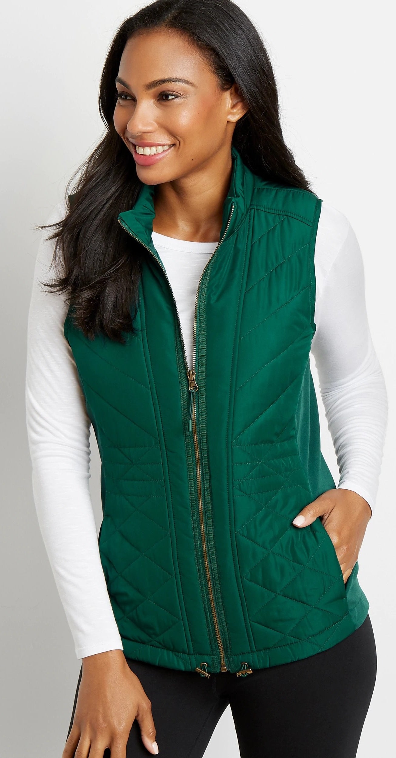 Model wearing green vest