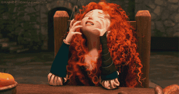 Merida putting her head down frustratedly 