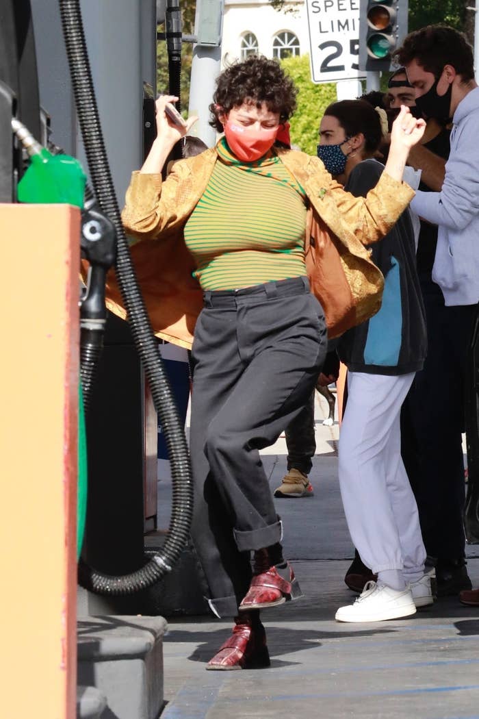 Actress Alia Shawkat celebrates Joe Biden&#x27;s victory at a local gas station in Los Feliz. She drank champagne and danced with the crowd