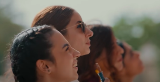 a group of women looking up at the sky