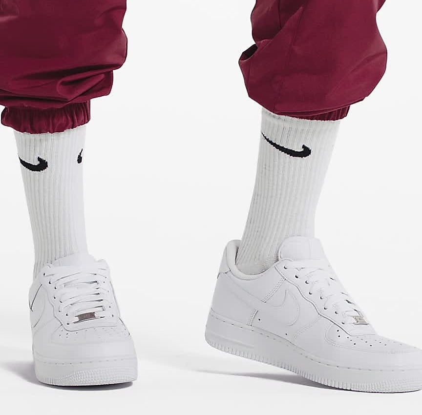 model in monochromatic white sneakers