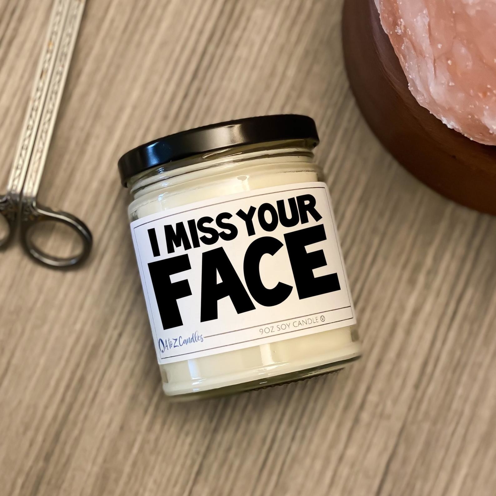 A candle that&#x27;s labeled &quot;I miss your face&quot;