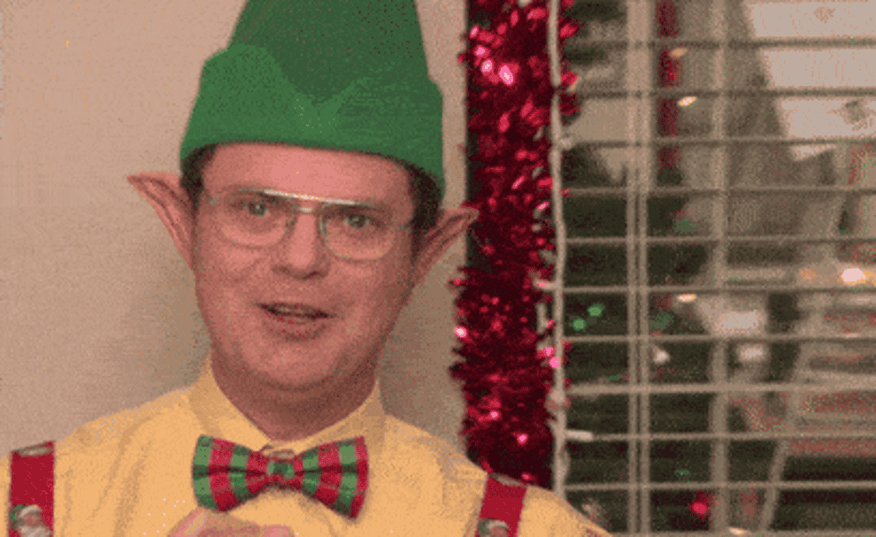 Dwight from The Office dressed up as an elf and smiling