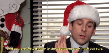 Michael Scott in a Santa hat from The Office