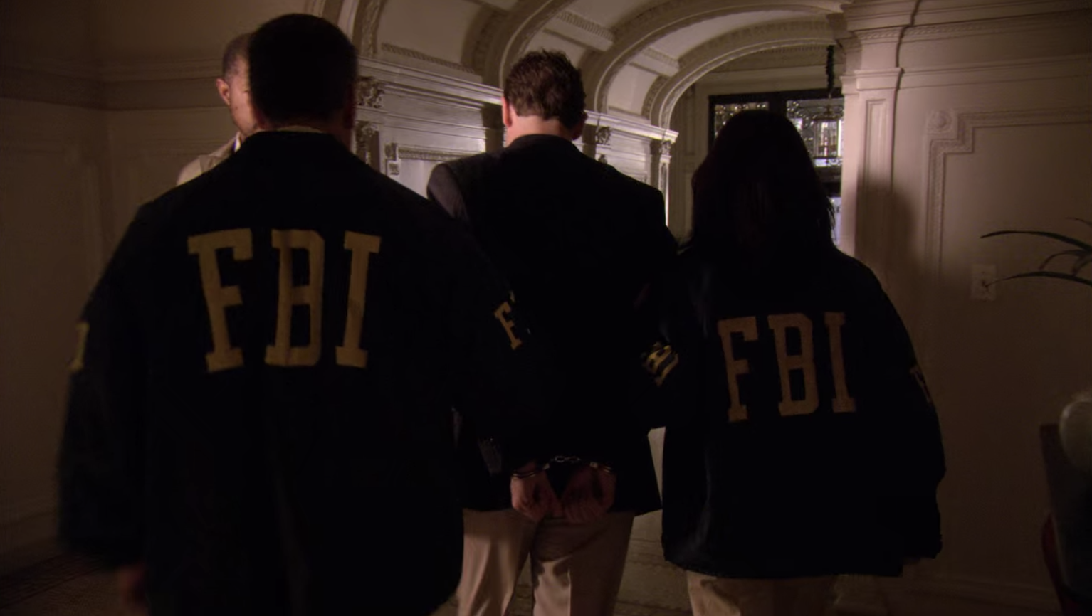 The Captain being escorted out by the FBI