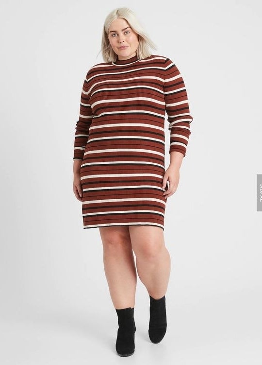person wearing a striped turtleneck sweater dress
