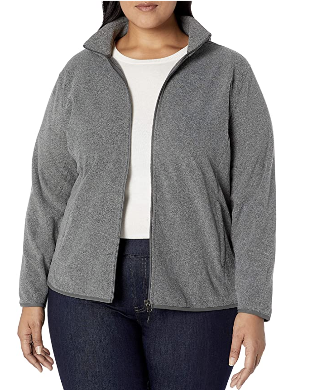 Model in a gray full zip fleece jacket with pockets and a high collar 