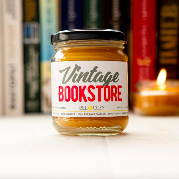 A jar candle with the label vintage bookstore on the front