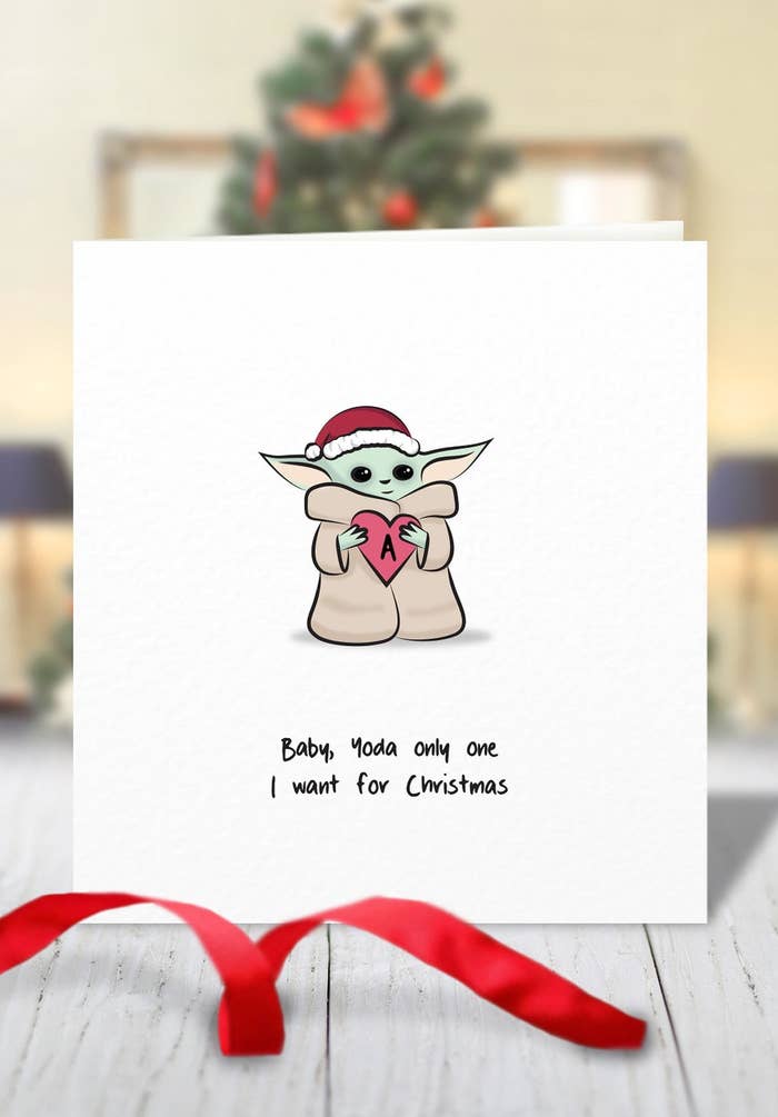 card with animated Baby Yoda wearing a Santa hat and holding a heart with the letter &quot;a&quot; on it. It says, &quot;Baby Yoda only one I want for Christmas&quot; and I could just cry because: cuteness overload 