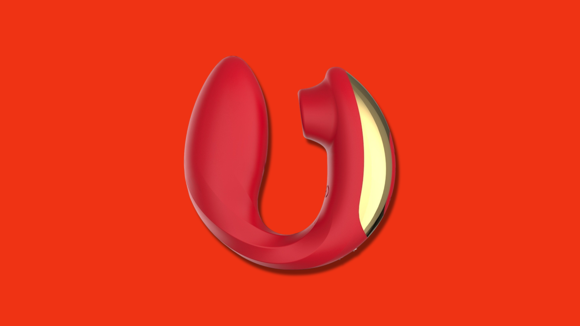 A red curved vibrator with gold accents on a red background.