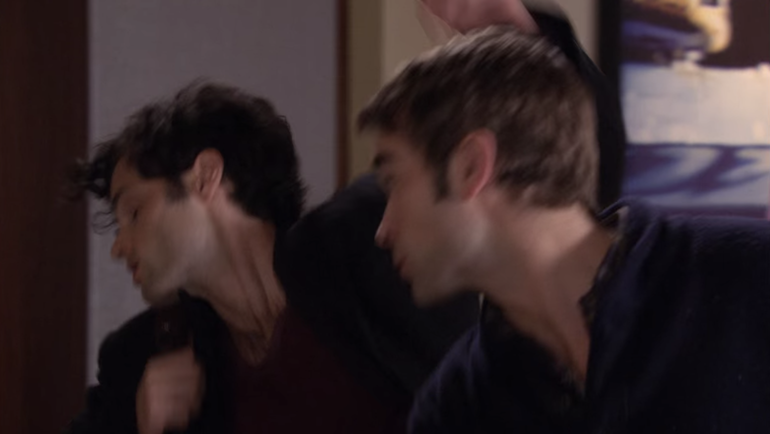 Nate punching Dan in the face