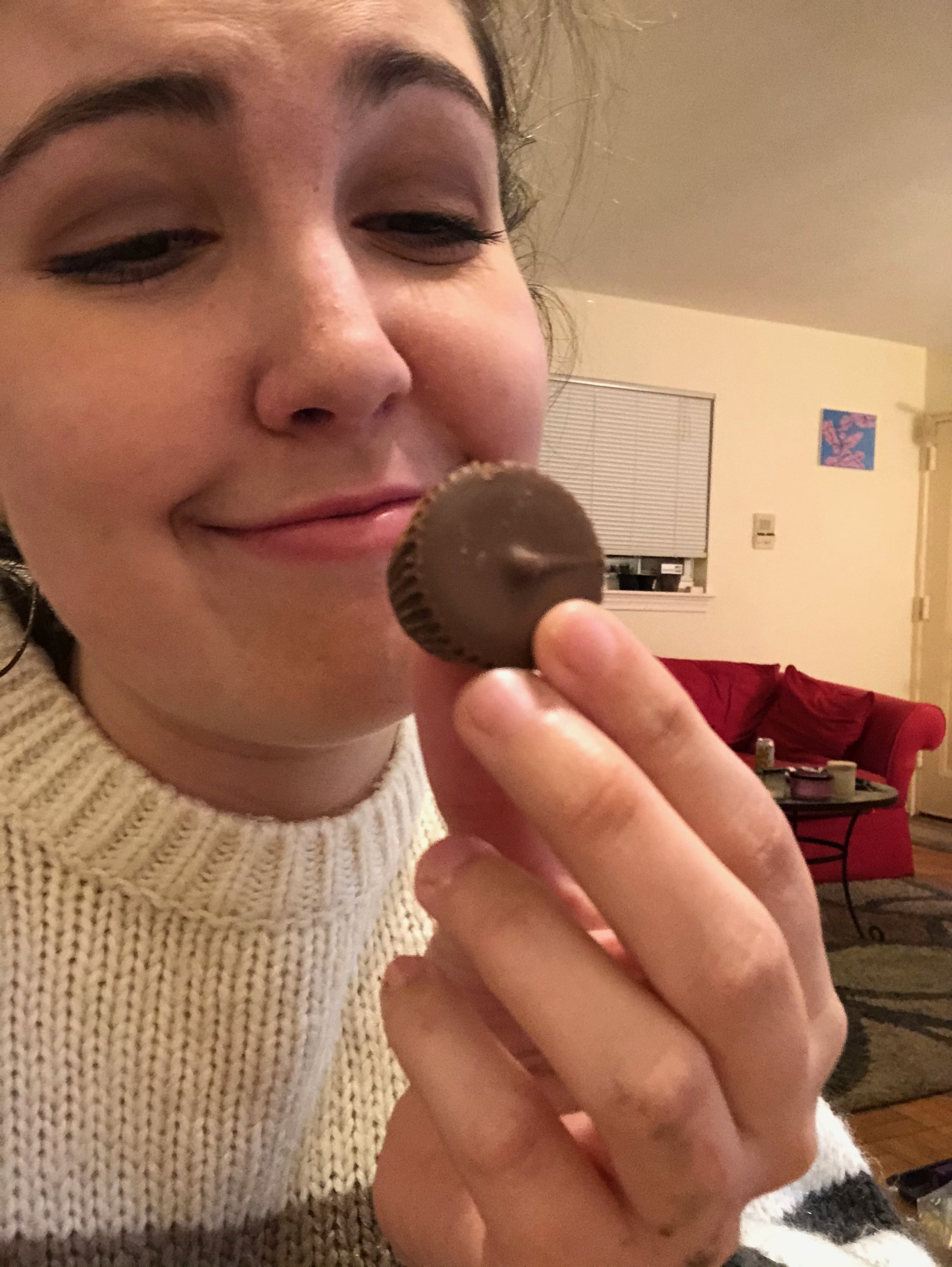 Andria staring longingly at peanut butter cups