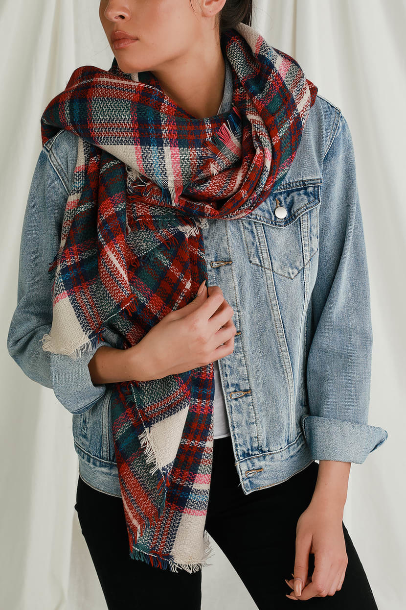 model wearing the red and green plaid scarf