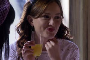 Blair sipping a mimosa