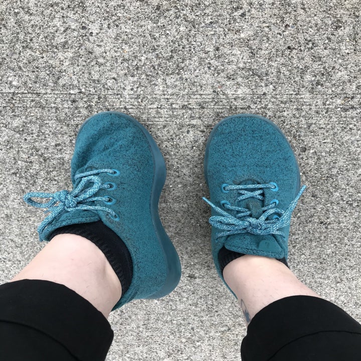 the writer wearing teal monochromatic sneakers
