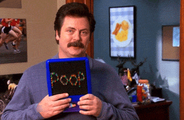 Gif of Ron Swanson holding a Lite Brite with the word poop spelled out in pegs
