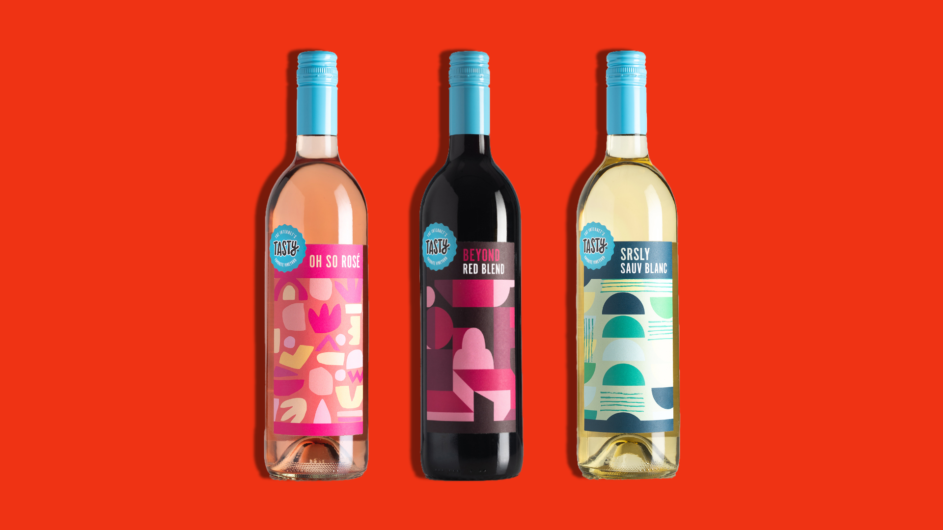 Three bottles of wine on a red background.