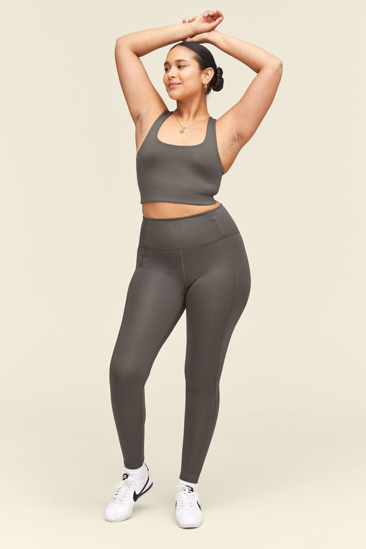 model wearing the gray matching leggings and sports bra 