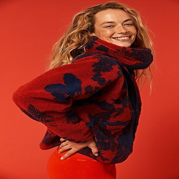 model wearing the red fleece jacket