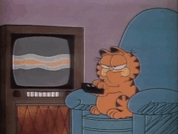 Garfield angrily clicking a TV remote 