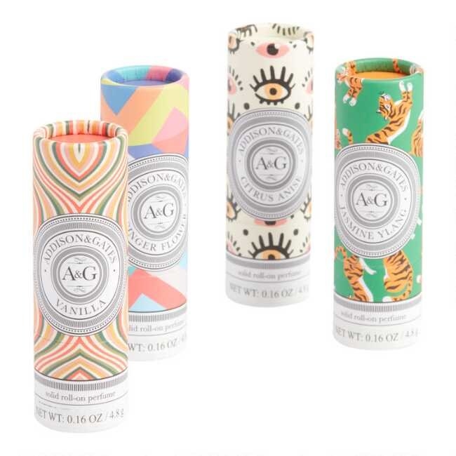 The four different solid perfumes which are in colorful with tubes with designs like eyes and tigers