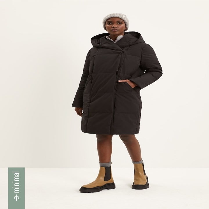 model wearing black puffer coat 