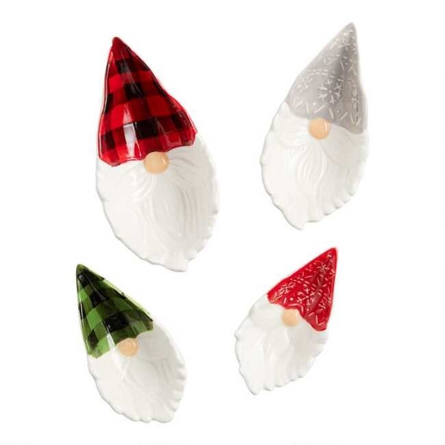 The set of four gnome measuring cups which have white beards and colorful caps