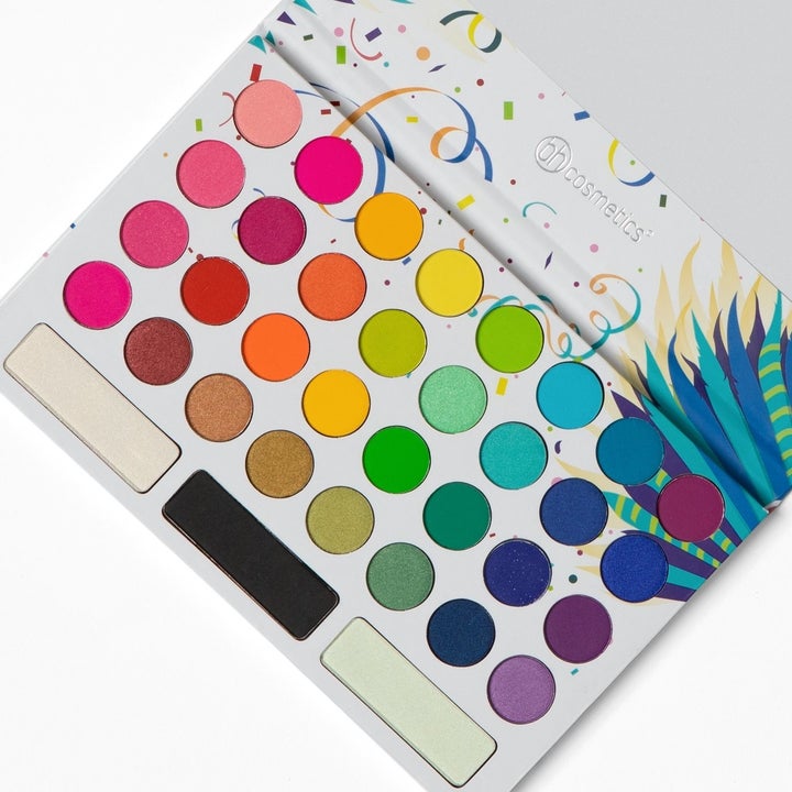 Eyeshadow palette with 35 shades of bright red, yellow, blue, green, and purple