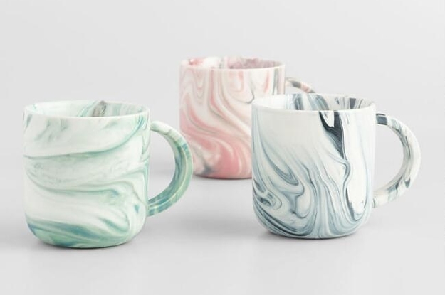 The set of marbled mugs which come in green, blue, and pink
