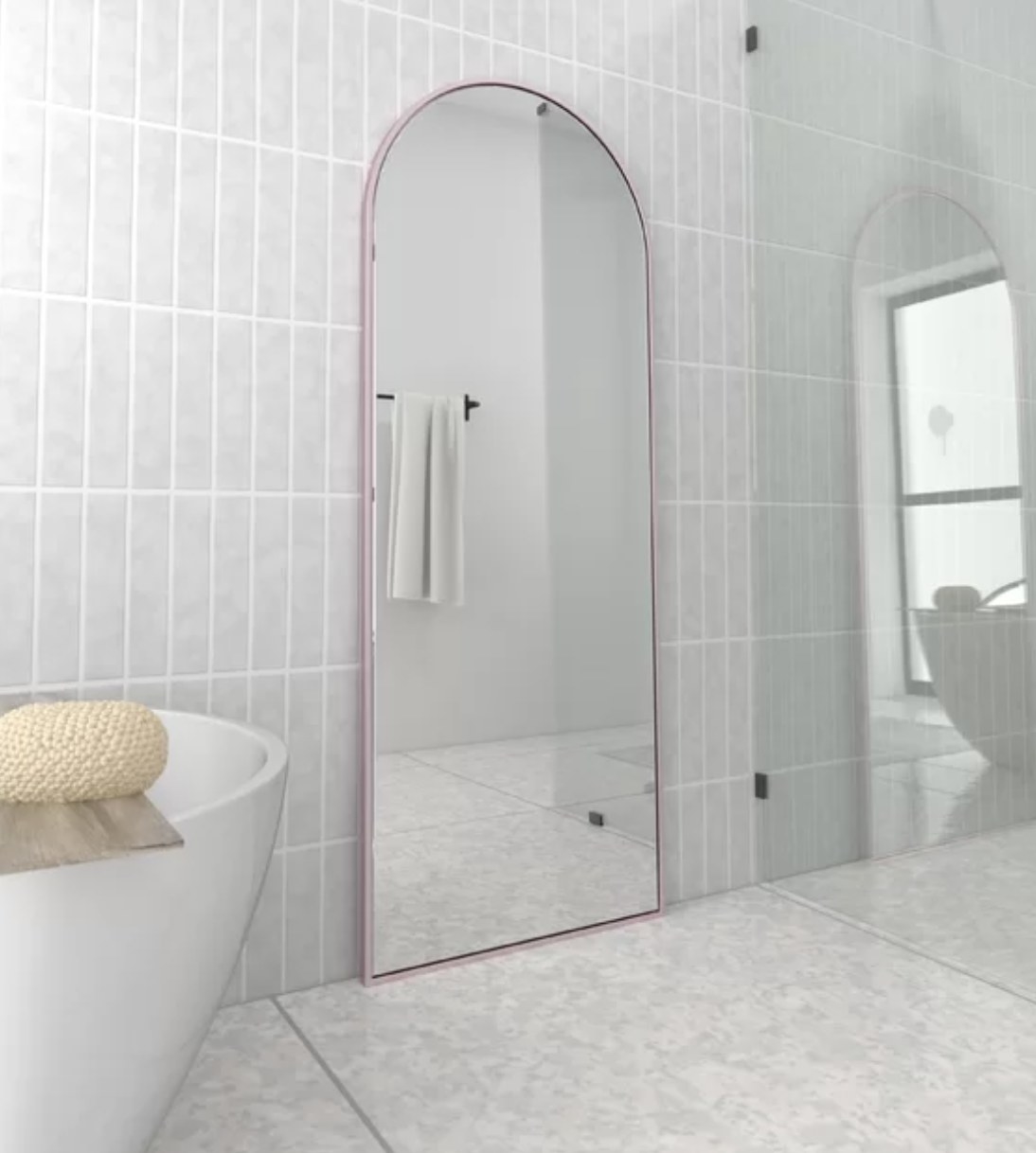 A floor-length mirror with pink trim