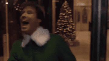 Will Ferrell in Elf running through a revolving door
