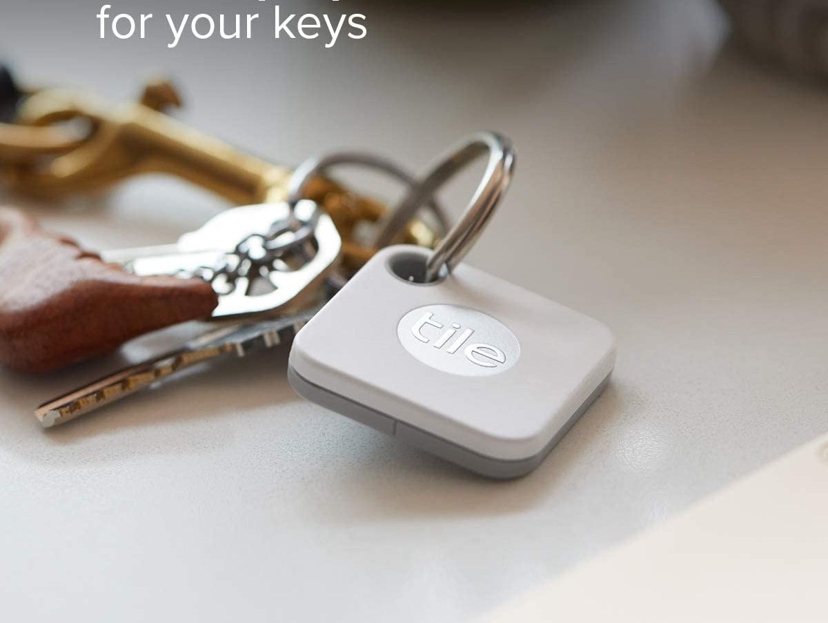 A white square Tile Mate attached to a key ring 