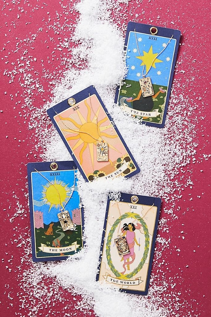 tarot cards with necklaces with small card pendants attached 