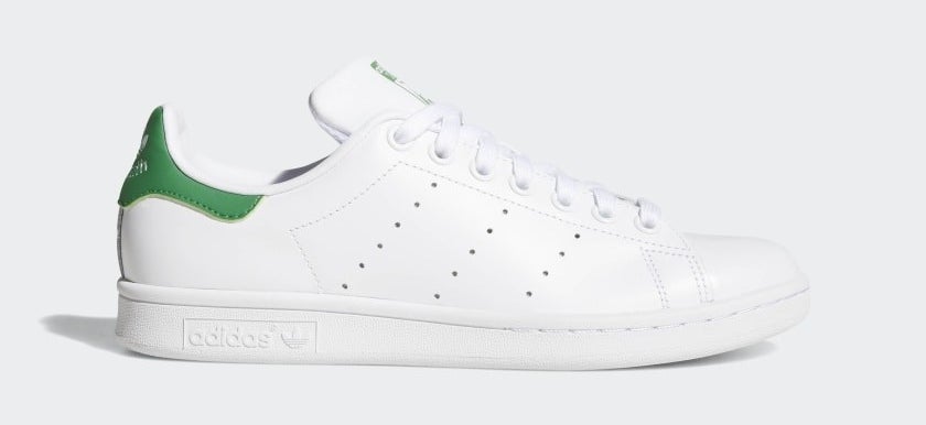 The white sneakers with green accents
