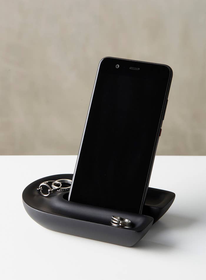 phone in stand with rings in grooves
