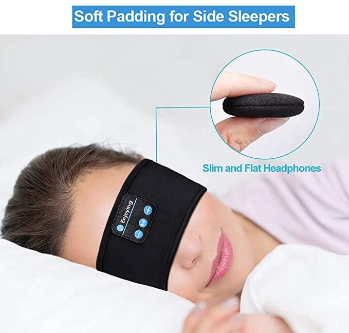 Woman sleeping and wearing the headphones band over her eyes.