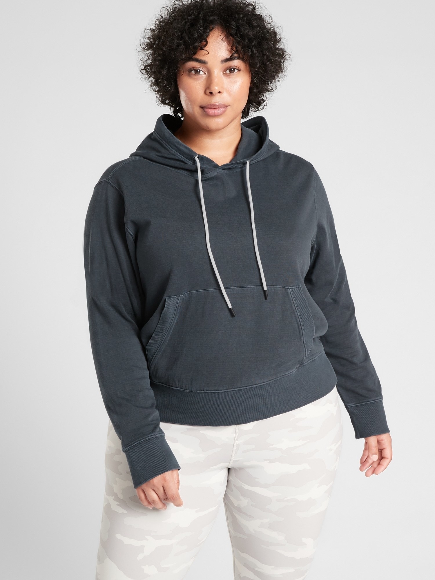 A model wearing the black hoodie
