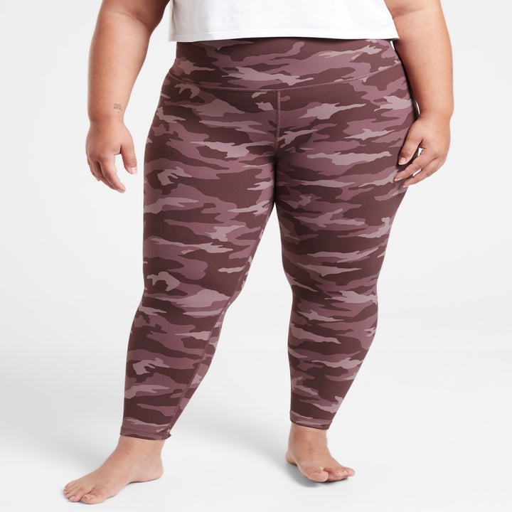 A model wearing the camo tights in mauve