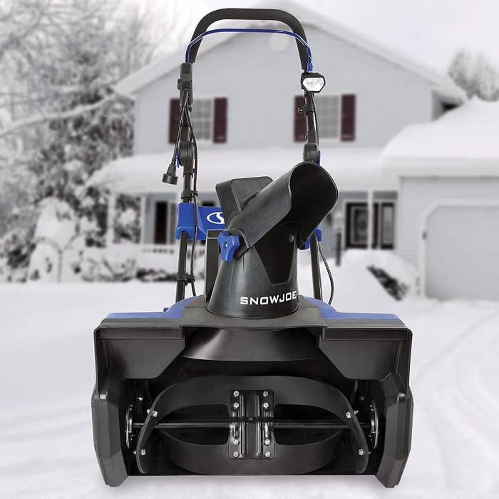 The snow blower in front of a house
