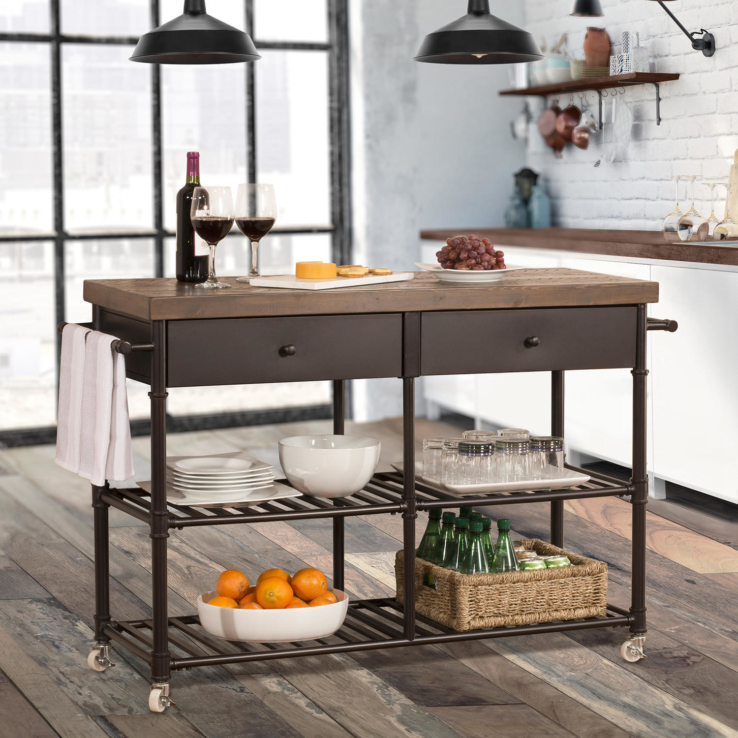 a brown cart on wheels with two shelves, two drawers, and a wooden tabletop